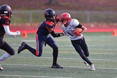 Old Rochester Youth Football 
Connor Nelson of the Old Rochester Youth Football 12-and-under team holds the snap as Giovanni Scherer kicks a field goal during the Bulldogs’ recent 30-24 victory over previously undefeated Manchester, Connecticut. Photo courtesy of Phil Mello
