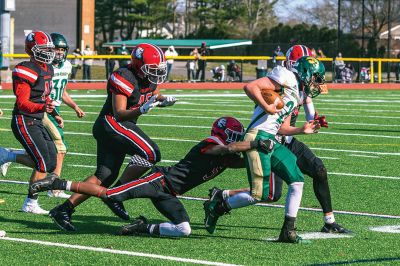 ORR Football
The Old Rochester Regional High School football team opened its season in a 42-15 defeat against Dighton-Rehoboth on March 27 in New Bedford. Above, Stephen Arne picks up a first down for the Bulldogs. Top right, Hayden Rinta (20) powers his way through the gap. Right, the Bulldogs take the play from Ryon Thomas (1). Bottom right, ORR's Jayven Pina Francis brings down D-R's Jaren Ramos. Below, Ryon Thomas throws deep down the sideline. Photos by Ryan Feeney
