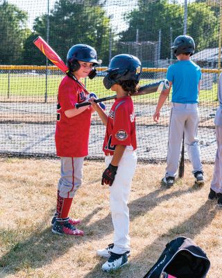 Old Rochester Youth Baseball League 
Players gather around the batting cage as they prepare for the start of the Old Rochester Youth Baseball League season during Monday night’s practice at Gifford Park in Rochester. The ORYB season set to open with games beginning Monday, June 29, includes a 12-week, Monday-Thursday schedule for Major and Minor divisions. T-Ball and Farm divisions will play on 11 weekends this summer. All games will be played at Dexter Lane and Gifford Park fields in Rochester and at Sippican School  Marion.Photo Ryan Feeney
