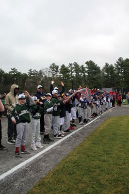 Old Rochester Youth Baseball League
Old Rochester Youth Baseball League players turn a cold, dreary Saturday morning into loads of fun by doing “the wave” during Opening Day festivities in Rochester. The day began with a parade from the Dexter Lane baseball complex down to Plumb Corner and a short distance along Mary’s Pond Road to Gifford Park, where a giant American flag hovered over the electronic scoreboard displaying the date 5-7-22, the first Opening Day for ORYB since 2019. Photo by Mick Colageo
