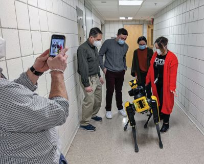 Spot
Kevin Garell from Boston Dynamics brought a robot named "Spot" for a lively demonstration at Rochester Memorial School. With assistance from his son Gavin, Mr. Garell showed off some of Spot's "training" and capabilities. The demonstration was the culmination of a series of projects during which Grade 6 students took on a challenge from NASA to design robotic devices with specific functions. The visit and associated lessons were coordinated by Grade 6 teachers Photo courtesy Erin Bednarczyk
