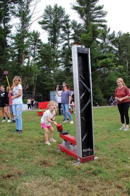 Old Colony PTO Family Festival 
Jenna Gifford of Mattapoisett swings the mallet at the high striker during Saturday’s Old Colony PTO Family Festival held at the vocational technical high school’s football field in Rochester. Gifford, a kindergarten student at Center School, turns 6 years old this week. Strength testers were part of the festival that also included bouncy houses, food trucks, games, arts and crafts, vendors, and antique cars. Photo by Mick Colageo
