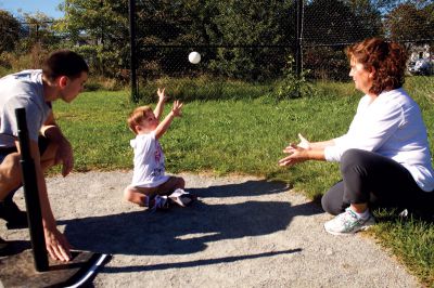 South Coast Special Olympics 
Volunteer Sean Mosher of New Bedford (left) watches Sharon Barrows of Mattapoisett (right) throw a ball to Thomas Jupin of Rochester (center), during the South Coast Special Olympics activities held at Center School in Mattapoisett on September 23, 2012.  Photo by Eric Tripoli.
