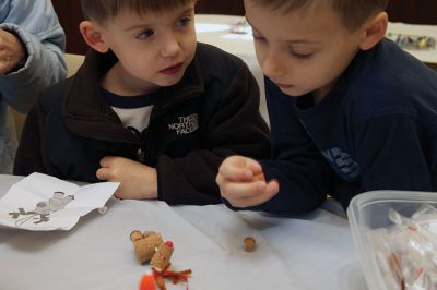 Holiday Ornaments
The Scully brothers, Austin (left) and Ethan (right) examine their reindeer ornament made out of cork.  Photo by Eric Tripoli.
