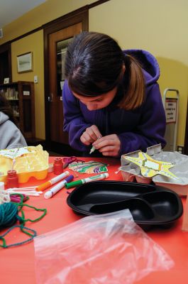 Library Crafts
On Saturday, December 19, 2009, the Mattapoisett Free Public Library hosted a ornament-making session. Children made seaside-themed holiday ornaments that included seashells, starfish, whelks, and everyone's favorite, Salty the Seahorse. Photo by Felix Perez.
