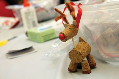 Holiday Ornaments
On Saturday, December 15, the Mattapoisett Library held a kids holiday ornament-making day.  The activity was organized by the Friends of the Library.  Families dropped in all afternoon to craft hand-made ornaments like reindeer made of cork.  Photo by Eric Tripoli.
