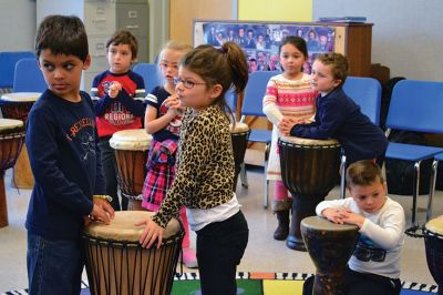 Otha Day
Drum master Otha Day spent the day with Rochester Memorial School students on November 21, giving lessons on rhythm and handing out percussion instruments, including drums and shakers, during drumming workshops held throughout the day. Photos By Jean Perry
