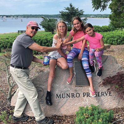 MLT Fundraiser
Mike Huguenin, president of the Mattapoisett Land Trust, thanks Lena, Maya, and Harper for their coffee can containing $214.76 from their bake sale.
