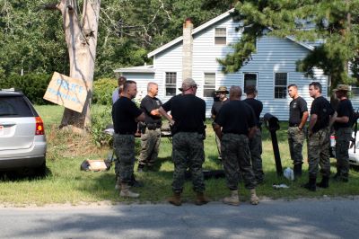 PD Training
On August 20, 2009, police officers from the Southeastern Massachusetts Law Enforcement Council Rapid Response team conducted training exercises at 73 County Road in Rochester from 8:00 am to 3:00 pm. 25 officers from various local police departments, including Mattapoisett, Rochester and Marion, gathered to practice flash bangs and simunitions. Photo by Paul Lopes
