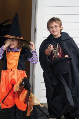 Plumb Corner Halloween
Rain didn't stop a few brave trick or treaters from coming to the October 24 Plumb Corner Halloween celebration. Businesses at Plumb Corner provided candy and shelter from the rain. A tent in the Plumb Corner field held a ghoulishly good time, with a devilish D.J. and Halloween-themed music. Photo by Anne O'Brien-Kakley.
