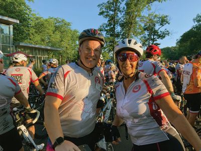 anMass Challenge
Rochester Memorial School teacher Debbi Bacchiocchi has become a regular rider of the PanMass Challenge, joining other Tri-Town community members in the mission to cure cancer. Here, she is pictured with Old Rochester Regional High School Athletic Director Bill Tilden and also with fellow Rochester residents Lazaro Rosa and Keith Riquinha at the start of the race on Day One. Bacchiocchi victoriously celebrated reaching Provincetown on Day Two and offered a look at the back of her racing shirt. Photos courte
