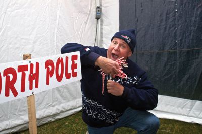 Holiday In The Park
Town media specialist, Danny White, steals candy canes from all the little children in Mattapoisett during the annual Holiday In The Park celebration. As a result for spoiling Christmas for countless children across town, Danny White will be getting a lump of coal in his stocking.  He's been a very naughty boy.  Photo by Eric Tripoli.
