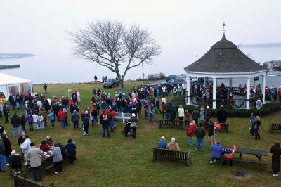 Holiday In The Park
On Saturday, December 8, hundreds of people turned out for Mattapoisett's annual Holiday In The Park celebration.  Shipyard Park was buzzing all afternoon with live music from the gazebo and free food and drinks under the big white tent.  Photo by Eric Tripoli.
