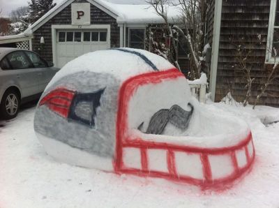 Go Pats!
Joann Price, Jim Price, Steven Price, Jennifer O’Neil, Tommy Morss and Janine Price are all responsible for the creation of the Patriot helmet in front of the Price residence on Acushnet Road in Mattapoisett. It took a lot of planning and building while watching the snow fall on Saturday and Buddy the Black Lab even helped out! They had a great time building it and hope it brings the Patriots a lot of luck! Photos courtesy of Janine Price
