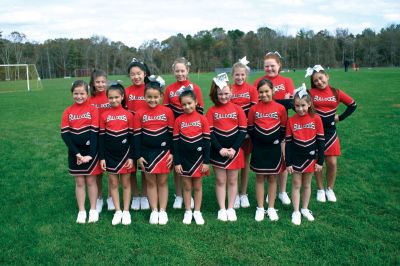 PeeWee Pantry
Under the direction of Coach Sarah Holick, the ORR Junior Pee Wee Cheerleader Squad collected dry and canned goods for Shepherd's Pantry in Acushnet at the Mini Mites football game on October 23, 2011. Photos by Robert Chiarito.
