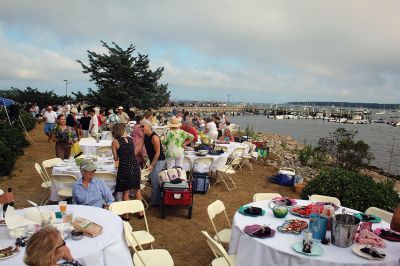 Great Picnic
Attendees at Friday night’s “Great Picnic” on the one-acre Munro preserve overlooking Mattapoisett Harbor enjoyed live music and adorned their tables with creatively competitive centerpieces featuring everything from a palm tree to pickleballs. Mattapoisett Land Trust Vice President Peter Davies told the Wanderer that the Mattapoisett Museum and the MLT have jointly organized the event for five nonconsecutive years. Proceeds from the annual event support their programs. Photos by Mick Colageo
