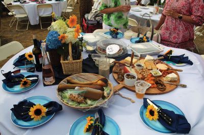 Great Picnic
Attendees at Friday night’s “Great Picnic” on the one-acre Munro preserve overlooking Mattapoisett Harbor enjoyed live music and adorned their tables with creatively competitive centerpieces featuring everything from a palm tree to pickleballs. Mattapoisett Land Trust Vice President Peter Davies told the Wanderer that the Mattapoisett Museum and the MLT have jointly organized the event for five nonconsecutive years. Proceeds from the annual event support their programs. Photos by Mick Colageo
