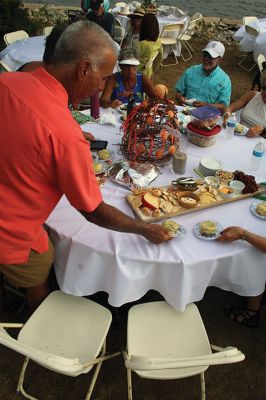 Great Picnic
Attendees at Friday night’s “Great Picnic” on the one-acre Munro preserve overlooking Mattapoisett Harbor enjoyed live music and adorned their tables with creatively competitive centerpieces featuring everything from a palm tree to pickleballs. Mattapoisett Land Trust Vice President Peter Davies told the Wanderer that the Mattapoisett Museum and the MLT have jointly organized the event for five nonconsecutive years. Proceeds from the annual event support their programs. Photos by Mick Colageo
