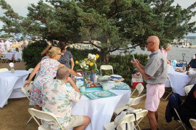 Great Picnic
Attendees at Friday night’s “Great Picnic” on the one-acre Munro preserve overlooking Mattapoisett Harbor enjoyed live music and adorned their tables with creatively competitive centerpieces featuring everything from a palm tree to pickleballs. Mattapoisett Land Trust Vice President Peter Davies told the Wanderer that the Mattapoisett Museum and the MLT have jointly organized the event for five nonconsecutive years. Proceeds from the annual event support their programs. Photos by Mick Colageo
