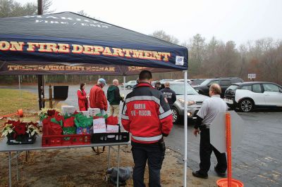 Pie & Poinsettia
In lieu of the annual senior luncheon, the Town of Marion collaborated with the Marion Fire Fighters Association, the Marion Police Brotherhood and Tabor Academy to hold a Pie & Poinsettia pickup on December 11 at the Cushing Community Center. Photos by Mick Colageo
