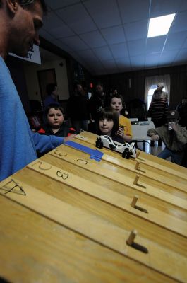 Pinewood Derby Time
Marion Cub Scout Troop #32 had its annual Pinewood Derby on February 8 at the Marion Congregational Church. Scouts assembled and designed their wooden racecars hoping to come in first place or win a prize for most original car or coolest car. Photos by Felix Perez
