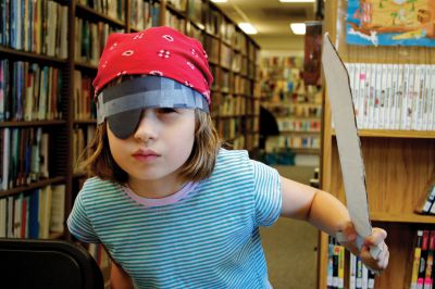 Talk Like A Pirate Day
Brenna O’Donnell gives her best pirate stare in a costume she designed, with the help of her mom and dad.  She came to Plumb Library on September 19 to celebrate International Talk Like A Pirate Day.  Photo by Eric Tripoli. 
