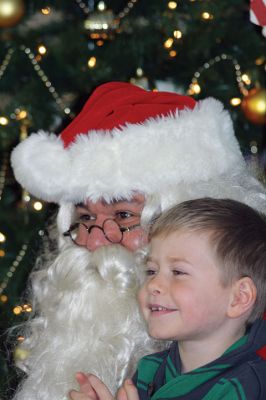 Pizza with Santa
It’s never Christmas in Marion until you’ve sat on Santa’s lap followed by a slice of pizza. Sunday was the annual Pizza with Santa, hosted by the Marion Police Brotherhood. Guests brought donated toys for families in need and enjoyed a hot slice of pizza with the man of the hour. Photos by Jean Perry 
