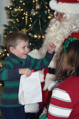 Pizza with Santa
It’s never Christmas in Marion until you’ve sat on Santa’s lap followed by a slice of pizza. Sunday was the annual Pizza with Santa, hosted by the Marion Police Brotherhood. Guests brought donated toys for families in need and enjoyed a hot slice of pizza with the man of the hour. Photos by Jean Perry 
