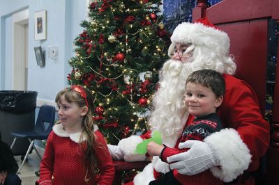 Santa and Mrs. Claus
Santa and Mrs. Claus made a stop at the Marion Police Brotherhood’s annual Pizza with Santa on Sunday, December 2, at the Benjamin D. Cushing Community Center. In addition to the jolly couple’s company, children and families enjoyed the pizza donated by Brewfish and even helped kick the Brotherhood’s Toy Drive into overdrive. Photos by Jean Perry
