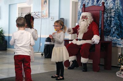 Pizza with Santa
The Marion Police Brotherhood held its annual Pizza with Santa at the Benjamin D. Cushing Community Center on Sunday, December 8. ‘Chief’ Santa and Mrs. Claus entertained the little ones before enjoying a pizza lunch. The Police Department’s “Fill a Cruiser” toy drive was in full gear as well, with several guests bringing toy donations to benefit children in foster care. Photos by Jean Perry
