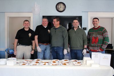 Pizza with Santa
The Marion Police Brotherhood held its annual Pizza with Santa at the Benjamin D. Cushing Community Center on Sunday, December 8. ‘Chief’ Santa and Mrs. Claus entertained the little ones before enjoying a pizza lunch. The Police Department’s “Fill a Cruiser” toy drive was in full gear as well, with several guests bringing toy donations to benefit children in foster care. Photos by Jean Perry
