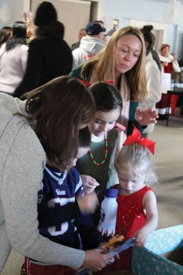 Pizza with Santa
The Marion Police Brotherhood held its annual Pizza with Santa at the Benjamin D. Cushing Community Center on Sunday, December 8. ‘Chief’ Santa and Mrs. Claus entertained the little ones before enjoying a pizza lunch. The Police Department’s “Fill a Cruiser” toy drive was in full gear as well, with several guests bringing toy donations to benefit children in foster care. Photos by Jean Perry
