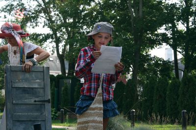 Summer Reading Play
On Friday, August 3, members of the Mattapoisett Library Summer Reading Program presented their final play of the season in their outdoor theater on the Library’s lawn.  Seven children participated in the play, which they wrote themselves.  The play was a compilation of various famous childhood tales, such as Jack in the Beanstalk.  Photo by Katy Fitzpatrick. 
