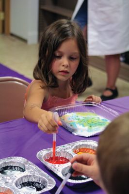 Science Roadshow
The Children’s Museum in Easton brought its Science Roadshow to the Plumb Library on August 6, and showed kids how to make a rocket out of a film canister (remember those?) and an Alka-Seltzer, and create sizzling artwork with vinegar, food coloring, and baking soda. Photos by Jean Perry
