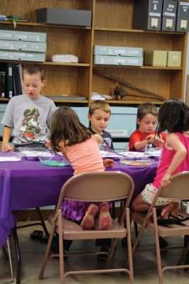 Science Roadshow
The Children’s Museum in Easton brought its Science Roadshow to the Plumb Library on August 6, and showed kids how to make a rocket out of a film canister (remember those?) and an Alka-Seltzer, and create sizzling artwork with vinegar, food coloring, and baking soda. Photos by Jean Perry
