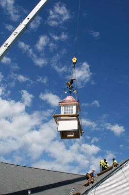 Plumb Library
A new cupola complete with a copper covered roof and refurbished bronze and copper eagle weathervane now graces the roof of the Plumb Library in Rochester center. Old Colony Regional Vocational Technical High School carpentry shop students in partnership with Diversified Roofing Systems, New Bedford, owned by Richard Miranda, built the new cupola for the town. Rochester’s facility manager Andrew Daniel spearheaded the project and brought together the school and business partners. Photo by Marilou Newell
