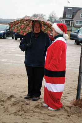 Christmas Day Swim
On Christmas Day 2014, about 50 hardy souls, young and old alike, ran with yelps of joy into 42-degree winter waters at Mattapoisett’s Town Beach. This annual event raises funds for Helping Hands and Hooves, a nonprofit organization in Mattapoisett that provides horseback riding lessons and therapeutic sessions for people with special needs. Photos by Marilou Newell
