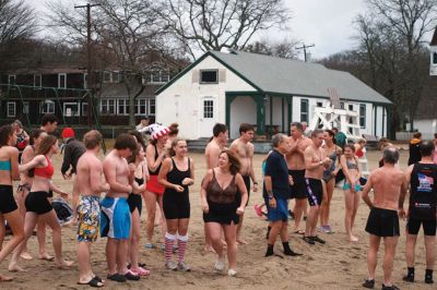 Christmas Day Swim
On Christmas Day 2014, about 50 hardy souls, young and old alike, ran with yelps of joy into 42-degree winter waters at Mattapoisett’s Town Beach. This annual event raises funds for Helping Hands and Hooves, a nonprofit organization in Mattapoisett that provides horseback riding lessons and therapeutic sessions for people with special needs. Photos by Marilou Newell
