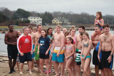 Christmas Day Swim
On Christmas Day 2014, about 50 hardy souls, young and old alike, ran with yelps of joy into 42-degree winter waters at Mattapoisett’s Town Beach. This annual event raises funds for Helping Hands and Hooves, a nonprofit organization in Mattapoisett that provides horseback riding lessons and therapeutic sessions for people with special needs. Photos by Marilou Newell
