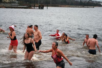 Christmas Day Swim
On Christmas Day 2014, about 50 hardy souls, young and old alike, ran with yelps of joy into 42-degree winter waters at Mattapoisett’s Town Beach. This annual event raises funds for Helping Hands and Hooves, a nonprofit organization in Mattapoisett that provides horseback riding lessons and therapeutic sessions for people with special needs. Photos by Marilou Newell
