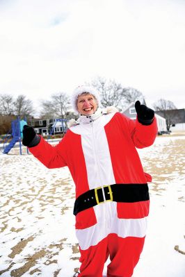 Christmas Day Swim
The Helping Hands and Hooves’ annual Christmas Day Swim was preceded by a polar plunge in the weather and a brief ‘snownado’ of sorts as the winds swept snow and sleet across the area only minutes before enthusiastic participants in costume arrived at the Mattapoisett Town Beach and raced into the icy waters. Photos by Glenn C. Silva
