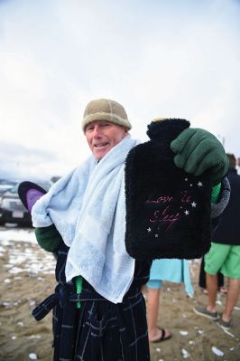 Christmas Day Swim
The Helping Hands and Hooves’ annual Christmas Day Swim was preceded by a polar plunge in the weather and a brief ‘snownado’ of sorts as the winds swept snow and sleet across the area only minutes before enthusiastic participants in costume arrived at the Mattapoisett Town Beach and raced into the icy waters. Photos by Glenn C. Silva
