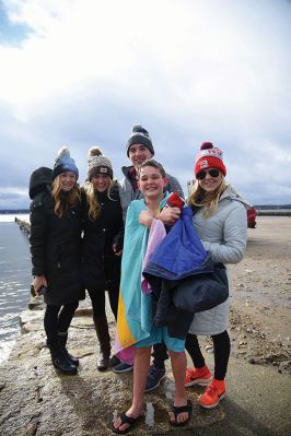 Christmas Day Swim
The Helping Hands and Hooves’ annual Christmas Day Swim was preceded by a polar plunge in the weather and a brief ‘snownado’ of sorts as the winds swept snow and sleet across the area only minutes before enthusiastic participants in costume arrived at the Mattapoisett Town Beach and raced into the icy waters. Photos by Glenn C. Silva
