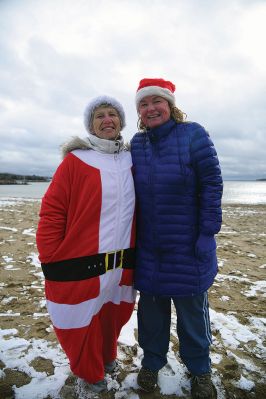 Christmas Day Swim
The Helping Hands and Hooves’ annual Christmas Day Swim was preceded by a polar plunge in the weather and a brief ‘snownado’ of sorts as the winds swept snow and sleet across the area only minutes before enthusiastic participants in costume arrived at the Mattapoisett Town Beach and raced into the icy waters. Photos by Glenn C. Silva
