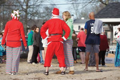 14th Annual Christmas Day Swim
The Helping Hands and Hooves 14th Annual Christmas Day Swim got a helping hand from the unseasonably warm weather, drawing in roughly 80 participants who took the polar plunge to support the organization’s therapeutic horseback riding program for adults with special needs. Photos by Colin Veitch
