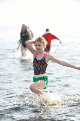 14th Annual Christmas Day Swim
The Helping Hands and Hooves 14th Annual Christmas Day Swim got a helping hand from the unseasonably warm weather, drawing in roughly 80 participants who took the polar plunge to support the organization’s therapeutic horseback riding program for adults with special needs. Photos by Colin Veitch
