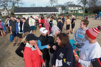 14th Annual Christmas Day Swim
The Helping Hands and Hooves 14th Annual Christmas Day Swim got a helping hand from the unseasonably warm weather, drawing in roughly 80 participants who took the polar plunge to support the organization’s therapeutic horseback riding program for adults with special needs. Photos by Colin Veitch
