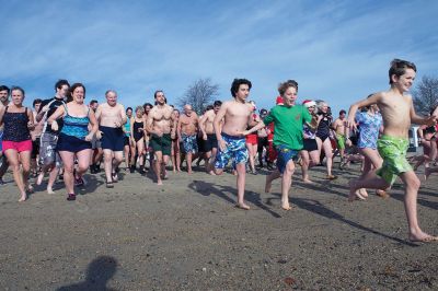 14th Annual Christmas Day Swim
The Helping Hands and Hooves 14th Annual Christmas Day Swim got a helping hand from the unseasonably warm weather, drawing in roughly 80 participants who took the polar plunge to support the organization’s therapeutic horseback riding program for adults with special needs. Photos by Colin Veitch
