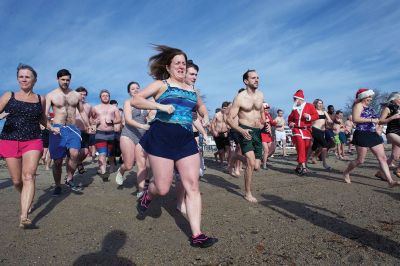 14th Annual Christmas Day Swim
The Helping Hands and Hooves 14th Annual Christmas Day Swim got a helping hand from the unseasonably warm weather, drawing in roughly 80 participants who took the polar plunge to support the organization’s therapeutic horseback riding program for adults with special needs. Photos by Colin Veitch
