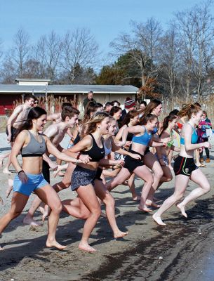 Tabor Academy Polar Plunge
Tabor Academy hosted its second annual Polar Plunge on Sunday, January 21 at Silvershell Beach to raise money for the school’s Special Olympics Young Athletes Program. Students from ‘fundraising rival’ Sandwich High also showed up, with scores of students and staff making a dash in and quickly out of the chilly waters. The plunge raised about $8,000. Photos by Deina Zartman
